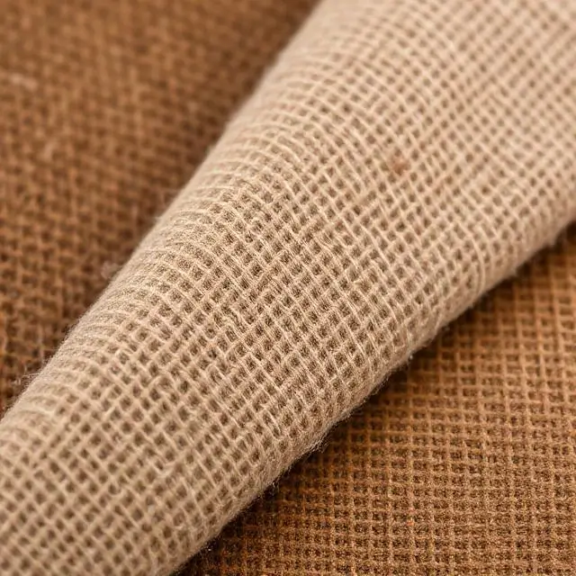 Close-up of different textured fabric swatches in earthy tones.
